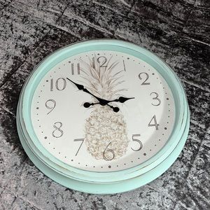 Teal pineapple clock for decorating! runs on batteries and is easy to hang up!